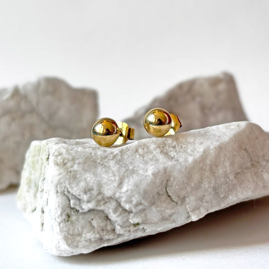 Aretes redondos de oro de 18k