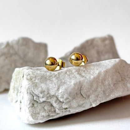 Aretes redondos de oro de 18k