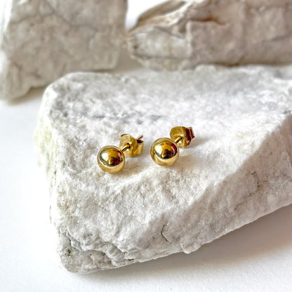 Aretes redondos de oro de 18k