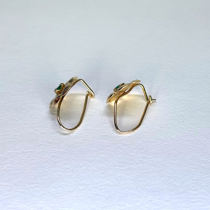 Aretes en forma de flor de oro de 18k con esmeraldas naturales colombianas